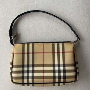Never used authentic Burberry purse. Size is 8 x 4 3/4